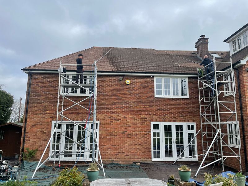 Roof cleaning carried out safely from scaffold towers by The Roof Moss Cleaners in Olney